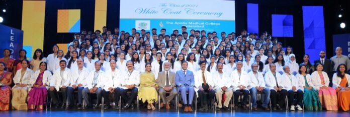 Students seen with Ms Aparna Reddy (seated 9th from left), COO, AMC; Dr Dilip Mathai (seated 10th from left),, Distinguished Professor & Advisor, AMC & Dr Raghu Ram Pillarisetti (seated 11th from left), OBE – Order of British Empire; Padma shri; Dr B C Roy Awardee and Founder Director, KIMS - Ushalakshmi Center for Breast Diseases, KIMS Hospitals, Hyderabad & faculty at the White Coat Ceremony hosted by The Apollo Medical College (AMC), Hyderabad at the RNR Auditorium, Jubilee Hills, today.